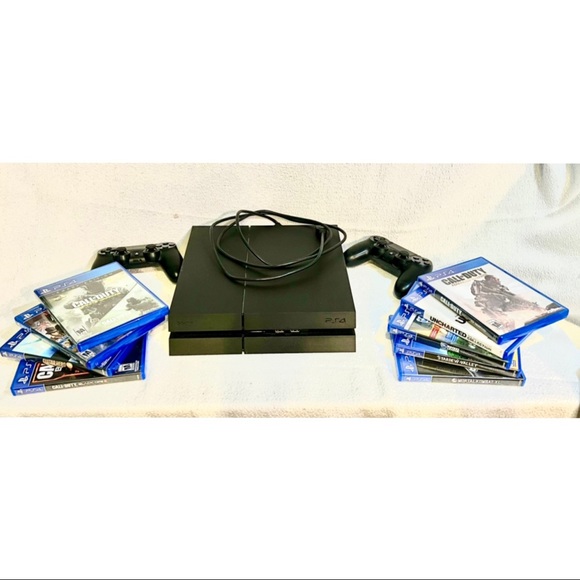 PS4 bundle with two controllers and 9 games.